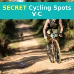 A man riding a bike down a dirt road