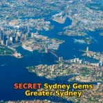 an aerial view of a city and a body of water