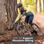 a man riding a mountain bike through a forest