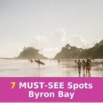 people walking along beach during daytime