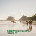 people walking along beach during daytime
