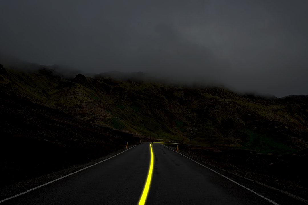 a road with a yellow line on the side of it