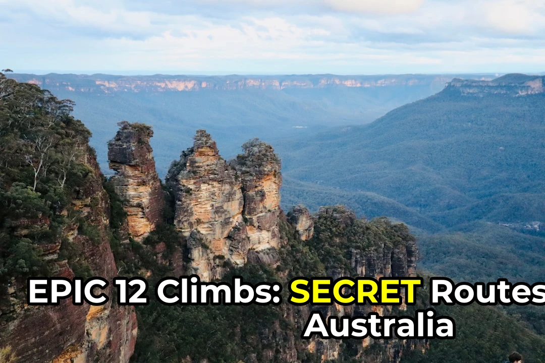 a rocky cliff with trees and a valley below with Three Sisters in the background