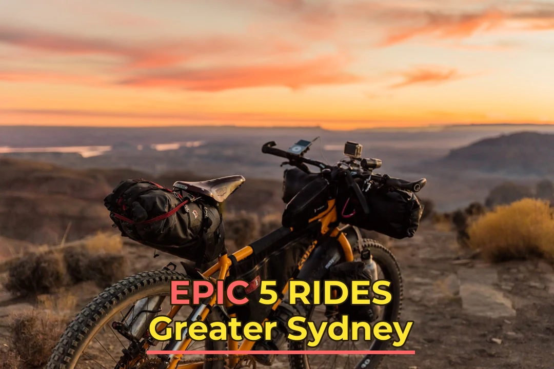 orange and black off-road bicycle on hill